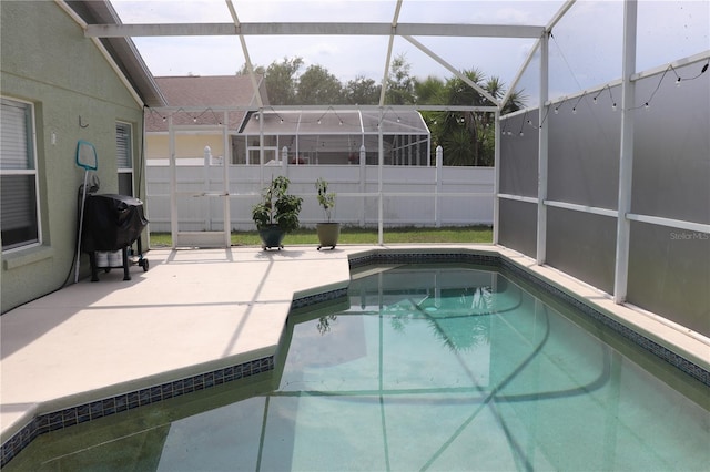 1048 Winding Water Way, Clermont, FL 34714 - view of swimming pool featuring a lanai, a patio, and grilling area