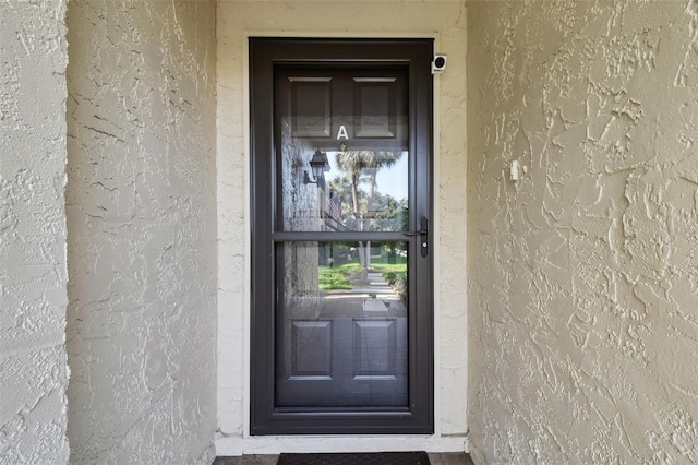 1801 E Lake Rd Unit 3A, Palm Harbor, FL 34685 - property entrance featuring stucco siding