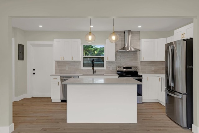 1352 Parkwood St, Clearwater, FL 33755 - kitchen with stainless steel appliances, wall chimney range hood, a sink, decorative backsplash, and recessed lighting