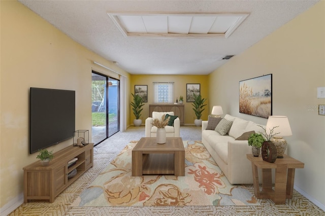 1249 Abbey Crescent Ln, Clearwater, FL 33759 - living room featuring baseboards and a textured ceiling