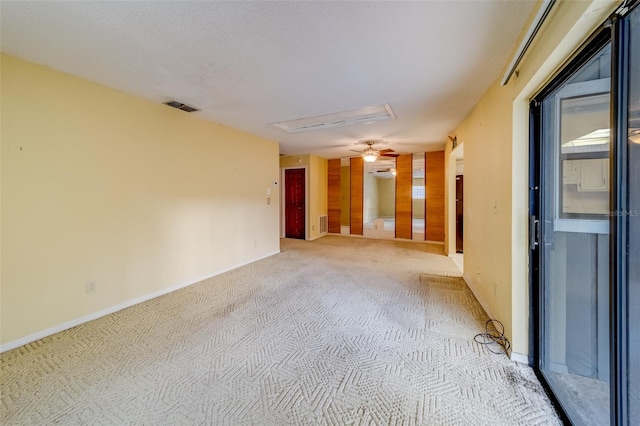 1249 Abbey Crescent Ln, Clearwater, FL 33759 - unfurnished room featuring light carpet, baseboards, attic access, and ceiling fan