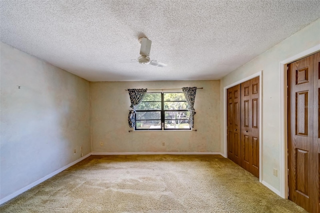 1249 Abbey Crescent Ln, Clearwater, FL 33759 - unfurnished bedroom featuring carpet flooring, ceiling fan, baseboards, a textured ceiling, and a closet