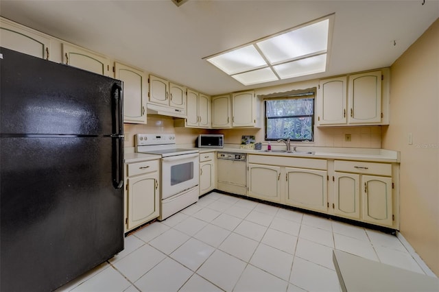 1249 Abbey Crescent Ln, Clearwater, FL 33759 - kitchen with white appliances, cream cabinets, and under cabinet range hood