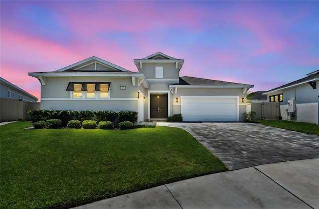 8421 Ivy Stark Blvd, Wesley Chapel, FL 33545 - view of front facade with stucco siding, decorative driveway, a garage, and a gate