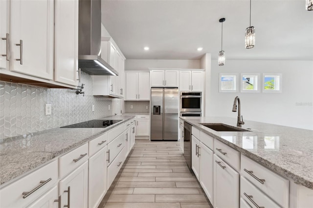 8421 Ivy Stark Blvd, Wesley Chapel, FL 33545 - kitchen with stainless steel appliances, a sink, wall chimney exhaust hood, white cabinetry, and tasteful backsplash