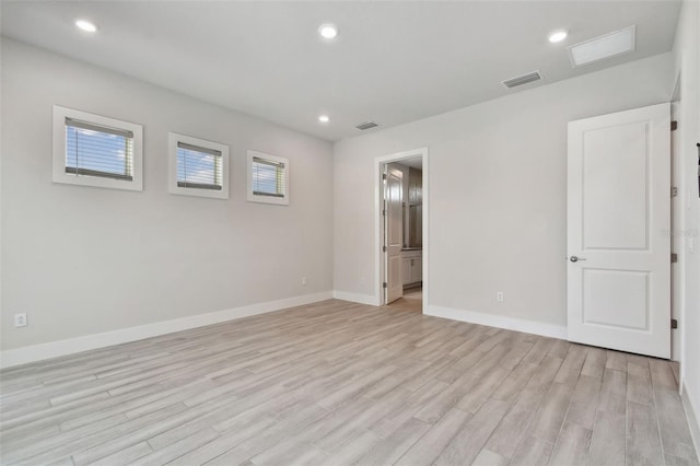 8421 Ivy Stark Blvd, Wesley Chapel, FL 33545 - unfurnished bedroom with light wood-type flooring, baseboards, and recessed lighting