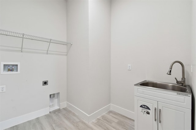 8421 Ivy Stark Blvd, Wesley Chapel, FL 33545 - laundry room with cabinet space, electric dryer hookup, hookup for a washing machine, and light wood finished floors