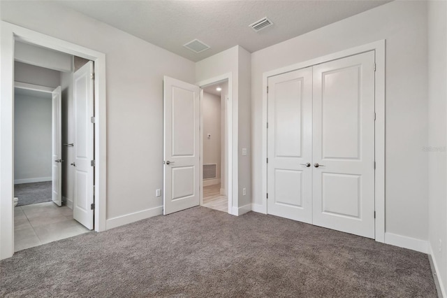 8421 Ivy Stark Blvd, Wesley Chapel, FL 33545 - unfurnished bedroom featuring carpet floors, baseboards, and a closet