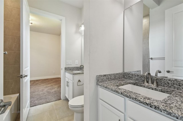 8421 Ivy Stark Blvd, Wesley Chapel, FL 33545 - full bath featuring vanity, toilet, tile patterned flooring, and baseboards