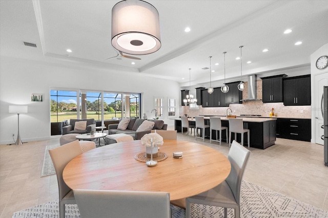 1416 Via Verdi Dr, Palm Harbor, FL 34683 - dining space with light tile patterned floors, recessed lighting, and a raised ceiling