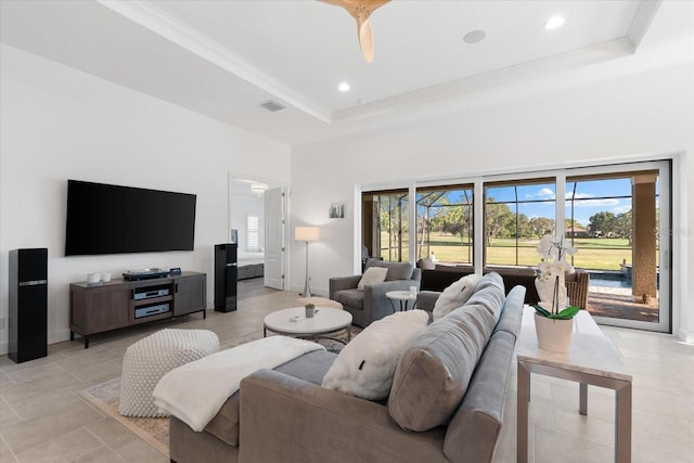 1416 Via Verdi Dr, Palm Harbor, FL 34683 - living room featuring a tray ceiling, a towering ceiling, recessed lighting, and crown molding