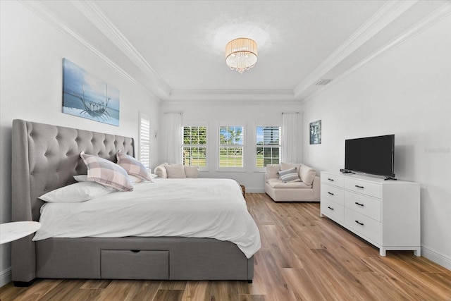1416 Via Verdi Dr, Palm Harbor, FL 34683 - bedroom featuring a tray ceiling, light wood-style flooring, crown molding, and a chandelier