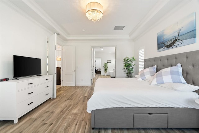 1416 Via Verdi Dr, Palm Harbor, FL 34683 - bedroom featuring light wood-style flooring, crown molding, and a chandelier