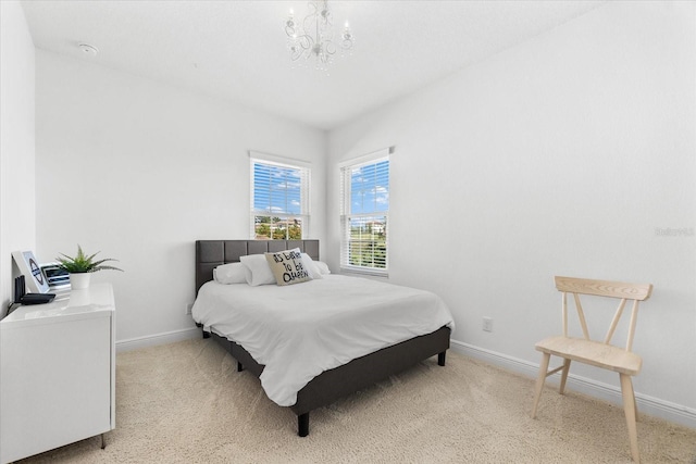 1416 Via Verdi Dr, Palm Harbor, FL 34683 - bedroom with a chandelier and light colored carpet