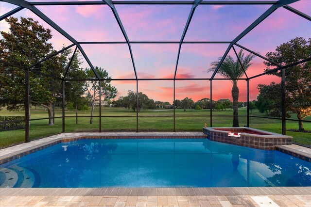 1416 Via Verdi Dr, Palm Harbor, FL 34683 - view of swimming pool featuring a lanai, a lawn, and a pool with connected hot tub