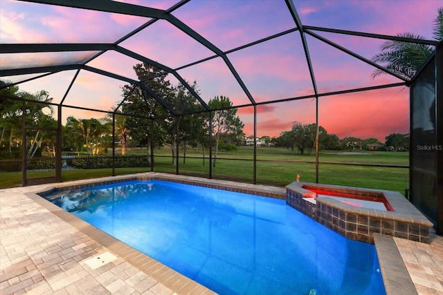 1416 Via Verdi Dr, Palm Harbor, FL 34683 - pool at dusk featuring a lawn, a patio, a lanai, and a pool with connected hot tub