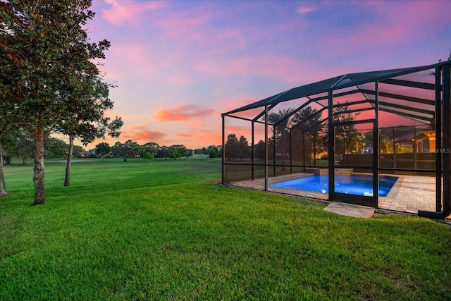 1416 Via Verdi Dr, Palm Harbor, FL 34683 - yard at dusk with an outdoor pool, a yard, and a patio