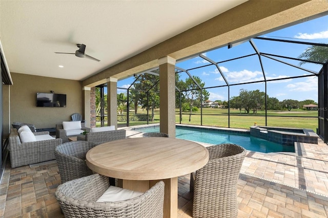 1416 Via Verdi Dr, Palm Harbor, FL 34683 - view of patio / terrace featuring a ceiling fan, a lanai, a pool with connected hot tub, and outdoor dining area