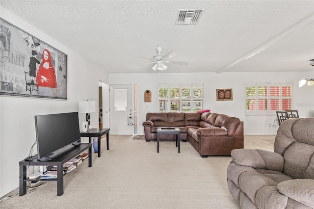 603 Royal Crest Dr, Brandon, FL 33511 - living area featuring a ceiling fan, light carpet, and a textured ceiling