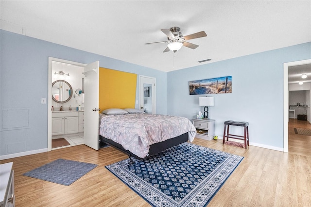 603 Royal Crest Dr, Brandon, FL 33511 - bedroom with wood finished floors, baseboards, connected bathroom, and ceiling fan