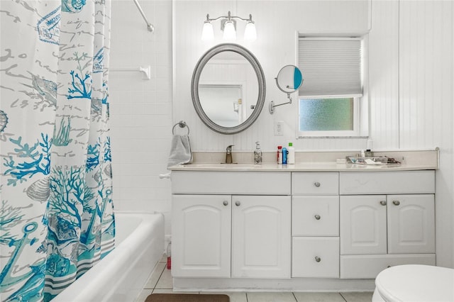 603 Royal Crest Dr, Brandon, FL 33511 - full bath featuring double vanity, shower / tub combo with curtain, tile patterned flooring, and toilet