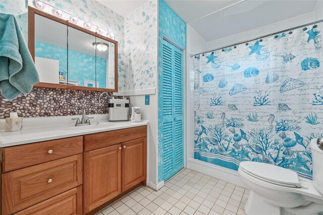 603 Royal Crest Dr, Brandon, FL 33511 - full bath featuring vanity, toilet, wallpapered walls, a closet, and tile patterned floors
