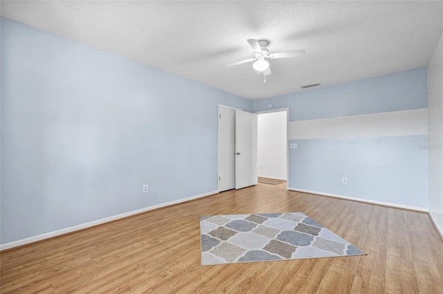 603 Royal Crest Dr, Brandon, FL 33511 - empty room featuring wood finished floors, ceiling fan, and baseboards