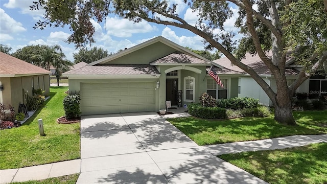 10449 Hunters Haven Blvd, Riverview, FL 33578 - ranch-style house featuring stucco siding, a garage, a shingled roof, and a front lawn