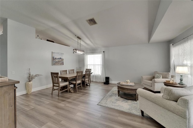 10449 Hunters Haven Blvd, Riverview, FL 33578 - living area with lofted ceiling, light wood-type flooring, and baseboards