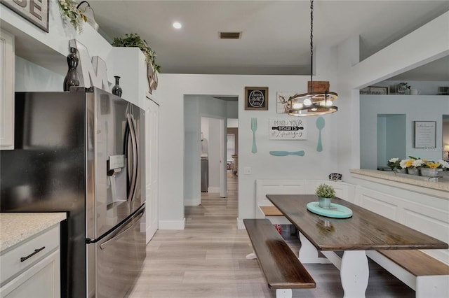 10449 Hunters Haven Blvd, Riverview, FL 33578 - dining space with light wood-style flooring and recessed lighting