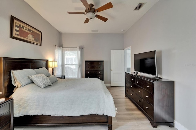 10449 Hunters Haven Blvd, Riverview, FL 33578 - bedroom with light wood-style floors, baseboards, and ceiling fan