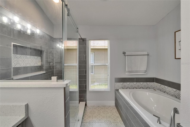 10449 Hunters Haven Blvd, Riverview, FL 33578 - full bathroom with a bath, baseboards, a tile shower, and tile patterned floors