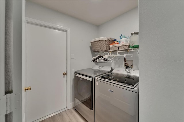 10449 Hunters Haven Blvd, Riverview, FL 33578 - washroom featuring independent washer and dryer and light wood-type flooring