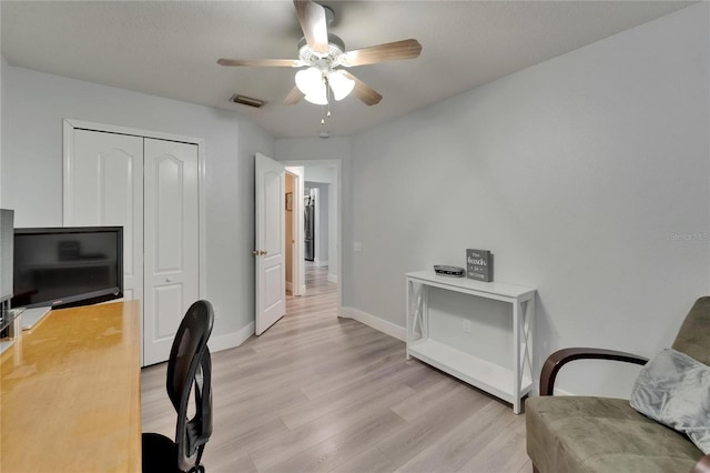 10449 Hunters Haven Blvd, Riverview, FL 33578 - office area with light wood-style flooring, ceiling fan, and baseboards