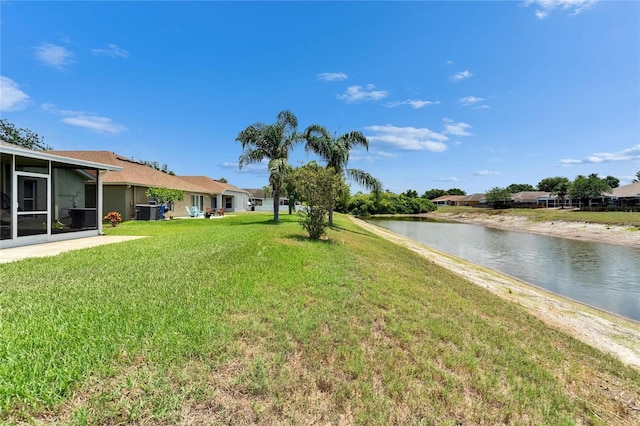 10449 Hunters Haven Blvd, Riverview, FL 33578 - view of green lawn with a water view and a sunroom