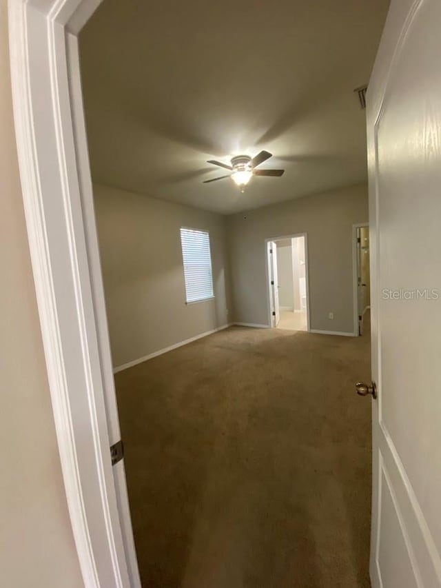 12202 Fairlawn Dr, Riverview, FL 33579 - empty room with ceiling fan, carpet floors, and baseboards