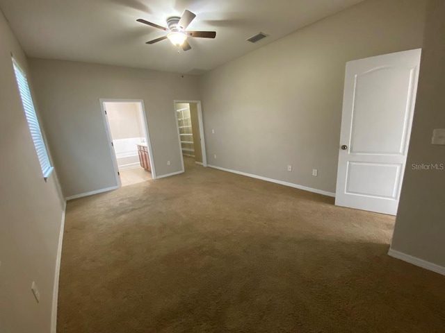 12202 Fairlawn Dr, Riverview, FL 33579 - unfurnished bedroom featuring baseboards, light colored carpet, and connected bathroom