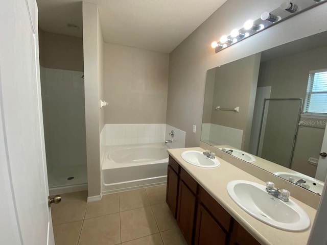 12202 Fairlawn Dr, Riverview, FL 33579 - full bathroom with tile patterned flooring, a shower stall, a garden tub, and double vanity