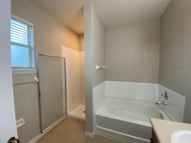 12202 Fairlawn Dr, Riverview, FL 33579 - full bathroom with tile patterned floors, vanity, a garden tub, and a stall shower