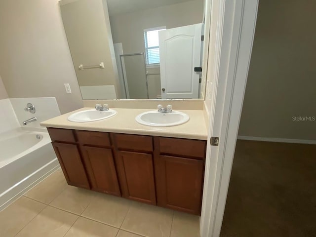 12202 Fairlawn Dr, Riverview, FL 33579 - full bathroom with a garden tub, tile patterned floors, double vanity, and a shower with door