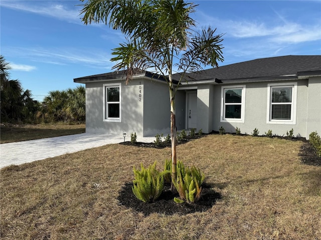 17099 Carleen Ave, Port Charlotte, FL 33948 - ranch-style home featuring stucco siding and a front lawn
