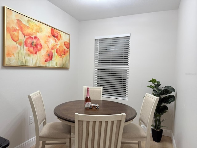 17099 Carleen Ave, Port Charlotte, FL 33948 - dining area with baseboards and wood finished floors