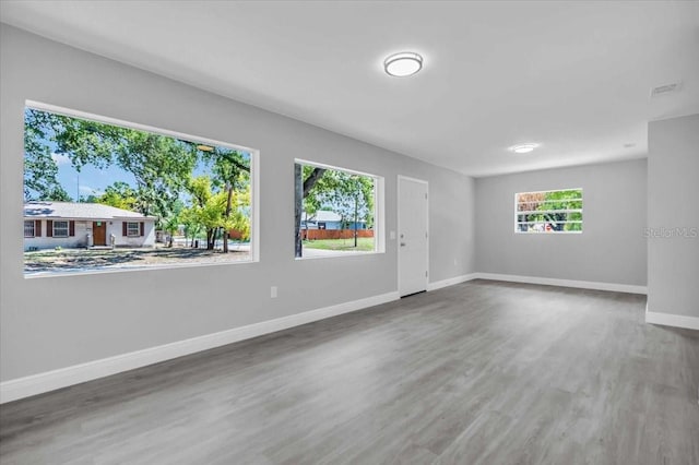 2711 E 22nd Ave, Tampa, FL 33605 - spare room featuring wood finished floors and baseboards