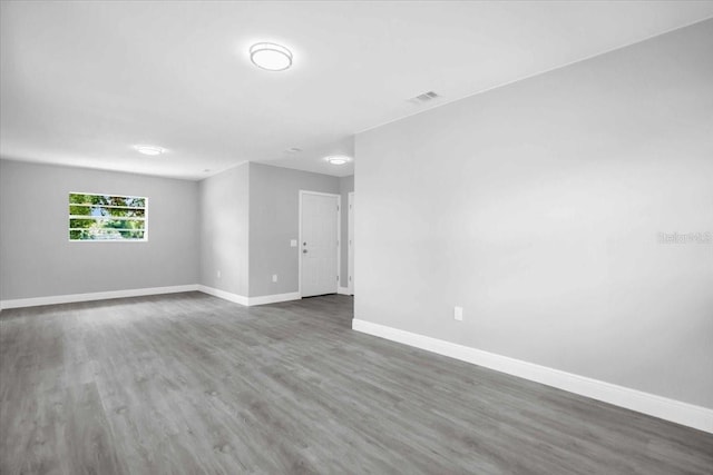 2711 E 22nd Ave, Tampa, FL 33605 - spare room featuring baseboards and wood finished floors