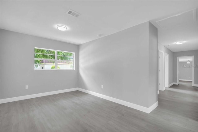 2711 E 22nd Ave, Tampa, FL 33605 - spare room with wood finished floors and baseboards