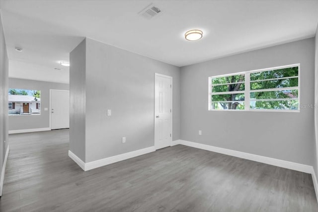 2711 E 22nd Ave, Tampa, FL 33605 - unfurnished room featuring baseboards and wood finished floors