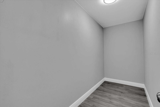 2711 E 22nd Ave, Tampa, FL 33605 - empty room with baseboards and dark wood-style floors