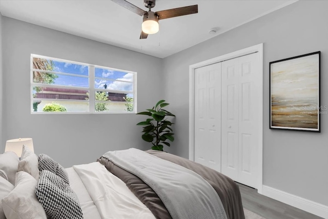 2711 E 22nd Ave, Tampa, FL 33605 - bedroom featuring baseboards, a closet, wood finished floors, and a ceiling fan