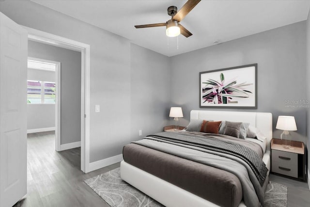 2711 E 22nd Ave, Tampa, FL 33605 - bedroom featuring baseboards, wood finished floors, and ceiling fan