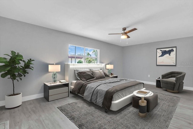 2711 E 22nd Ave, Tampa, FL 33605 - bedroom featuring baseboards, light wood-style floors, and a ceiling fan